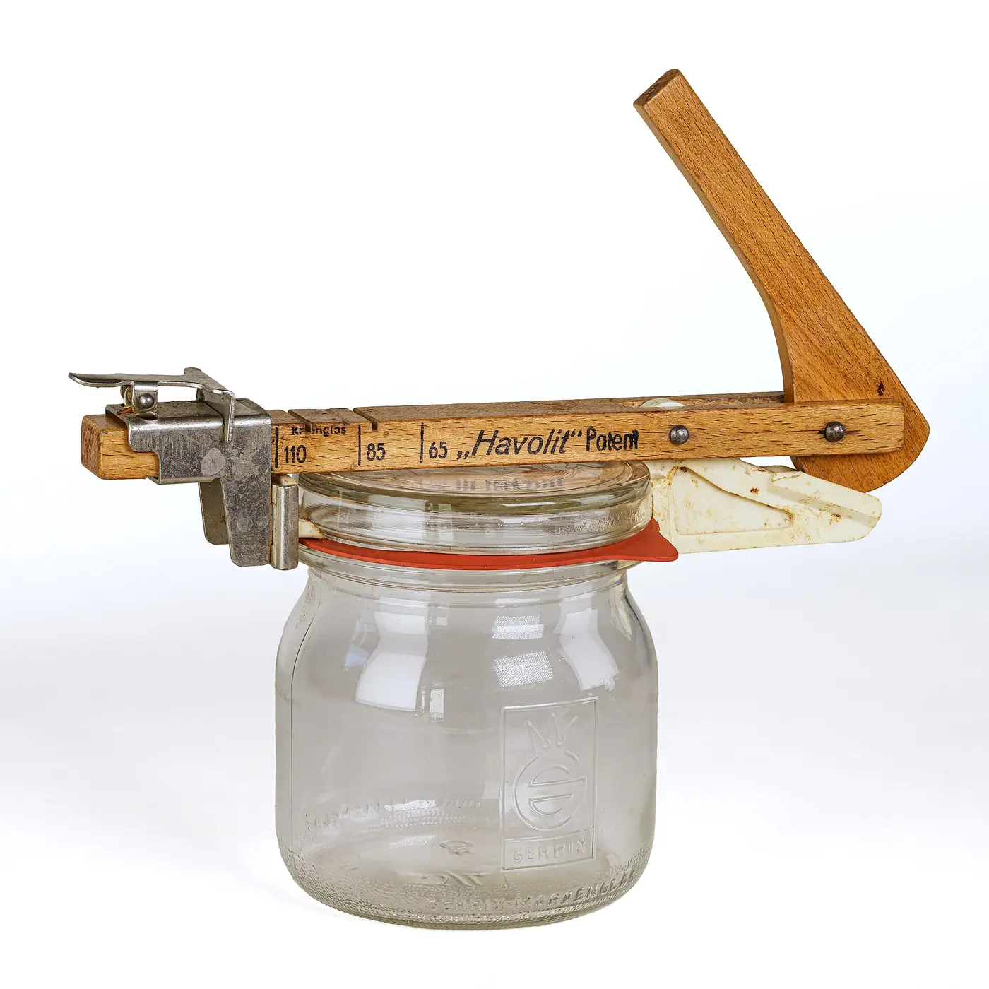 A 1950s wooden lever jar opener fitted to a glass preserving jar